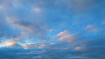 Obraz premium Beautiful colorful colored clouds in the summer sky. Multicolored bright sky at sunset. Timelapse.