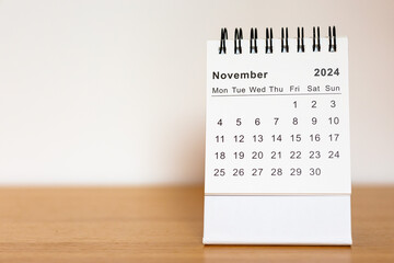 2024 calendar - November month page on the wooden desk