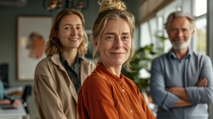 Fototapeta premium Happy diverse colleagues in Dutch office environment, working with morning light