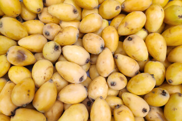 Stack of loquats on a market stall