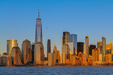 The evolving Downtown Manhattan skyline at sunset, panoramic view from Liberty State Park. High...