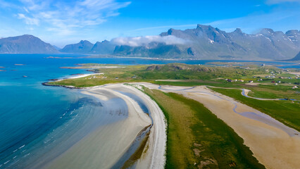 Kolbeinsanden Beach, Lofoten, panorama of a secluded beach in Norway, nestled between lush green hills and a sparkling blue ocean.