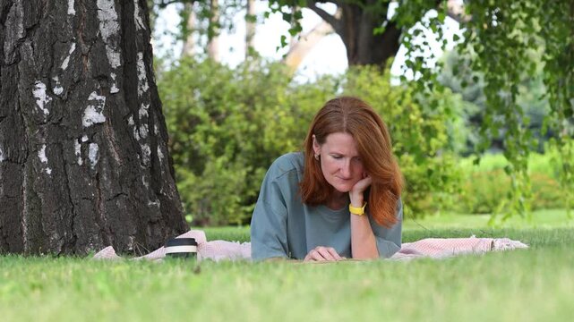 woman reading in a park