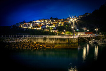 Obraz premium Night view of Lastres village and port. Asturias. Spain