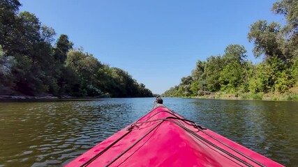 Kayaking and ecotourism. A group of people floating along the river.