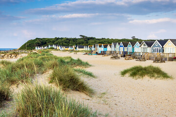 Colourful Beach huts on Mudeford Spit in Dorset, England. Beach huts here are the most expensive in UK.