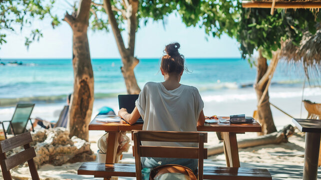 A person working remotely from a picturesque outdoor setting, like a beachside café or a park, blending the themes of remote work and summer leisure