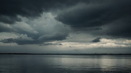 Obraz premium Dramatic and moody image of an overcast stormy sky reflecting over a still lake, capturing a tranquil yet foreboding atmosphere perfect for depicting tension