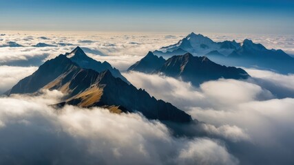 Naklejka premium A breathtaking mountain landscape with peaks rising through the clouds, offering a serene and majestic view, perfect for adventure, travel, and nature appreciation