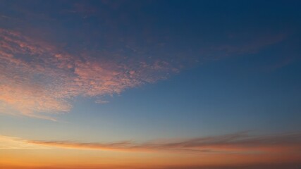 Fototapeta premium A serene twilight sky with shades of blue, pink, and orange, creating a calm and peaceful atmosphere Perfect for nature, landscape, and tranquil themes