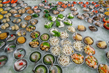 Yumcha, dim sum in bamboo steamer, Chinese cuisine. Variety of dim sum. A cozy dim sum set with a variety of dishes, ready to be enjoyed by diners