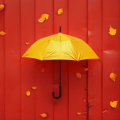 Yellow umbrella on a pastel red background. Minimalistic aesthetic autumn concept.