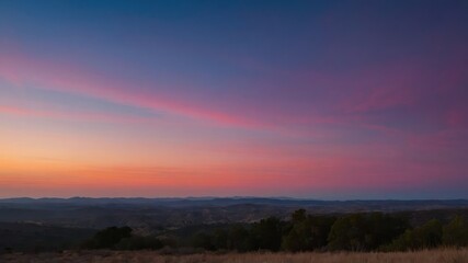 A scenic view of sunrise with vibrant colors in the sky, showcasing a serene and peaceful landscape ideal for nature appreciation and relaxation concepts