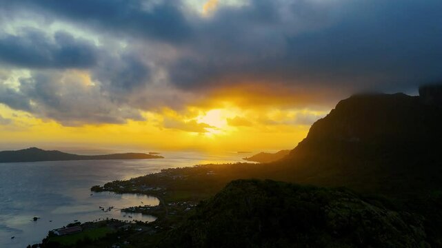 Dramatic sunset behind Mount Otemanu on the tropical island of Bora Bora in French Polynesia. Drone footage.