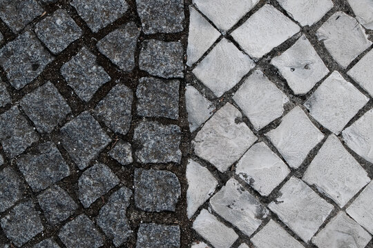 a close up of a stone pattern on a portuguese sidewalk