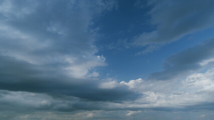 Obraz premium Beautiful rainy dark storm clouds. Rainy sky. Magic dramatic sky in rainy weather. Timelapse.