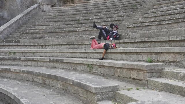 Catrin and Catrina Posing Elegantly on Stone Steps