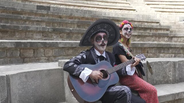Mexican traditional Catrin and Catrina Making Music Together