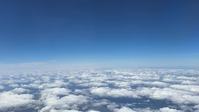 White cumulus clouds on clear blue sky background closeup, overcast skies backdrop, fluffy cloud texture, beautiful sunny cloudscape heaven, ozone layer illustration, scenic cloudy weather