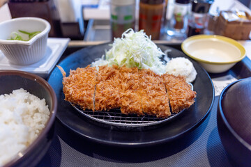 Japanese Breakfast. Fried Chicken with Salad, Rice and Sause. Miso Soup