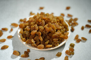 Raisins are placed on a bowl..