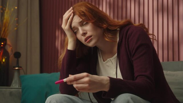 Sad woman pregnant girl at home stressed hold pregnancy test positive or negative result upset female future mother frustrated anxious unwell health problem medicine abortion infertility healthcare