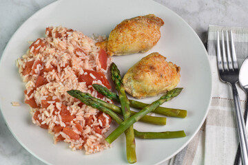 seasoned chicken thighs  with rice and asparagus