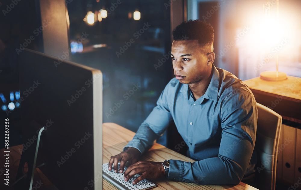 Fototapete dark, office and black man at computer typing, online research or web programmer at tech startup. ni