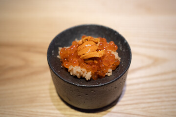 Omakase Uni Ikura Don served with Japanese rice, topped with salmon roe and sea urchin.