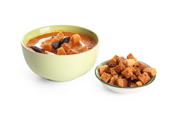 Bowl of tasty cream soup with croutons on white background