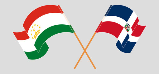 Crossed and waving flags of Tajikistan and Dominican Republic. Vector illustration
