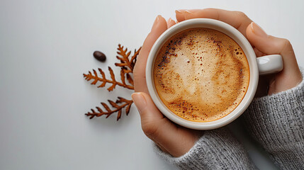 A top view of a hot coffee in a mug, showing rich textures and foam art on the surface