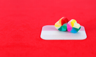 Pair of colorful hearts on adhesive note