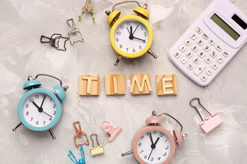 Text TIME with alarm clocks and calculator on grey background. Time management concept. Top view