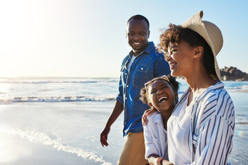 Black family, parents and girl by ocean, space and mockup with bonding, waves and people in sunshine on holiday. Father, mother and daughter with joke, laughing or excited by sea with hug on vacation