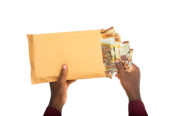 black male hands holding opened brown envelope containing Kenyan shilling notes on transparent background
