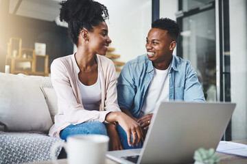 Laptop, happy and black couple on sofa for online banking, internet payment and website in home. Dating, relationship and man and woman on computer for bonding, ecommerce and relax in living room