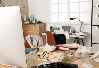Messy workplace with garbage in office