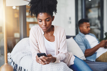 Phone, ignore and black couple on sofa in home for tension in argument, conflict and communication. Dating, relationship and man and woman on smartphone for cheating, chat and social media attention
