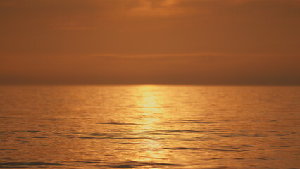Naklejka premium Sun Shine Water Background. Reflection Of Sunlight Over Sea Or Ocean. Clean Ocean Ripples And Waves.