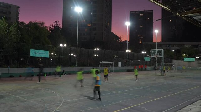 Timelapse of an Outdoor Basketball Court with People Playing on it.