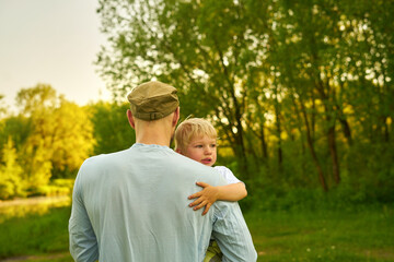 father and son in the park.