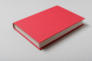 Big red book isolated on grey background, copy space.