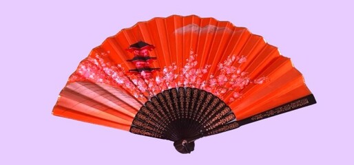 Bright orange Japanese hand fan featuring a cherry blossom and pagoda design, isolated on a pastel background