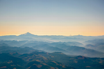 Aerial view at sunrise of Three Mountains and Valleys of Oregon