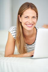 Fototapeta premium Woman, portrait smile and laptop for remote work with freelancer, writer and language blog in home. Happy translator, computer and lady for social media post, web journal and learning english online