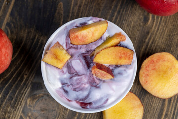 natural yogurt in a white bowl with fruits