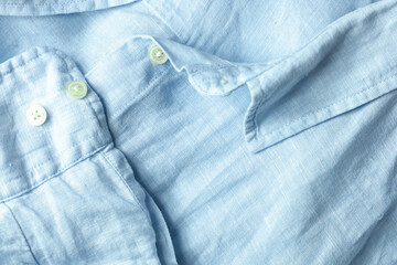 Collar and cuff detail from light blue linen shirt. High quality photo