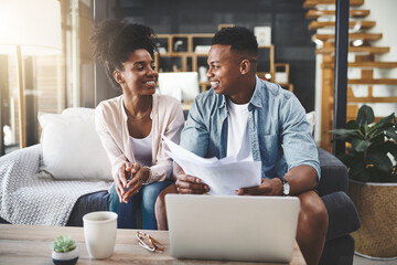Couple, laptop and smile with paperwork for finance on sofa with planning taxes or home with loan...