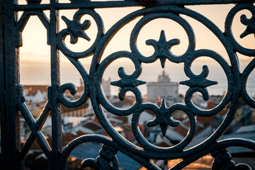 Ornate Wrought Iron Railing at Sunset